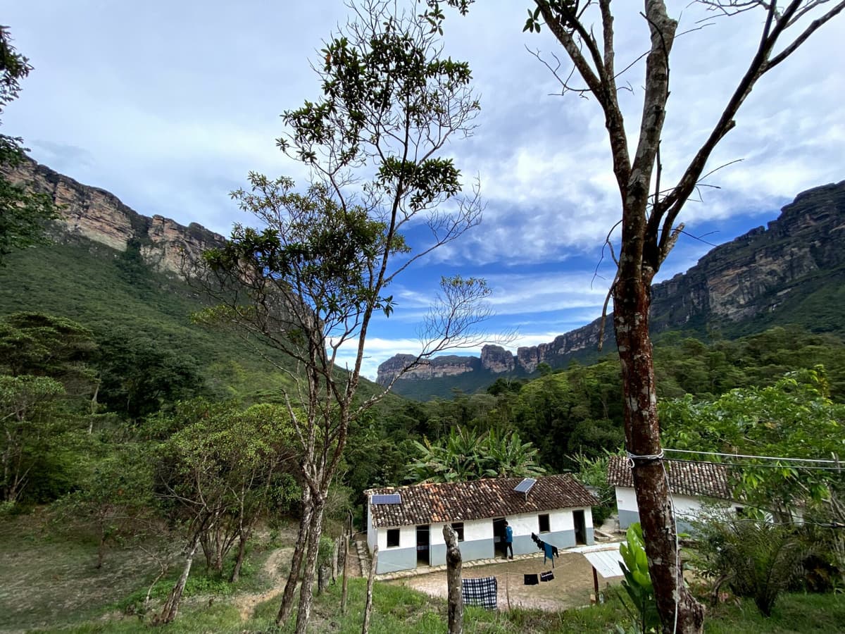Hikers pausing to admire the mountain views of Vale do Pati