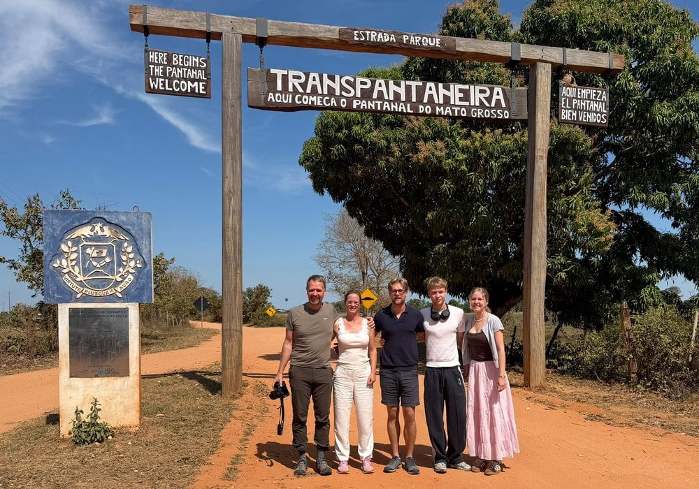 Michael's family under the Transpantaneira welcome gate at the entrance to the Pantanal