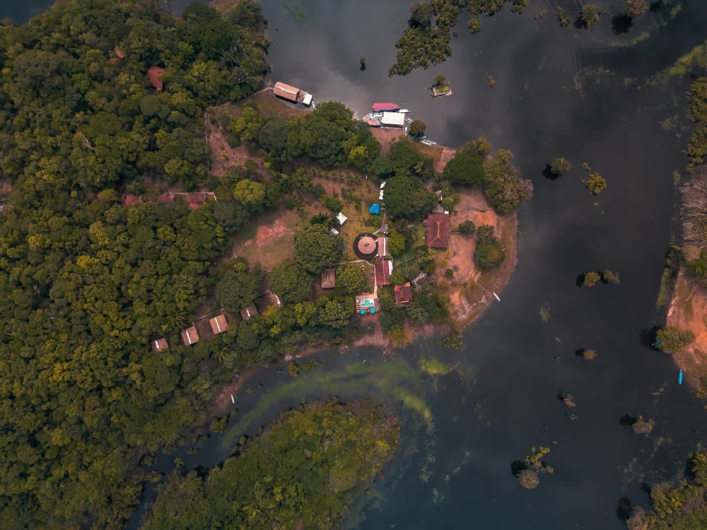 Aerial view of Amazon Turtle Lodge located by the river and deep inside the Brazilian Amazon rainforest. Aerial view of Amazon Turtle Lodge located by the river and deep inside the Brazilian Amazon rainforest.