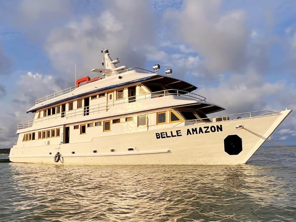The Belle Amazon white riverboat sailing on the water, part of the Kaiara fleet offering cruises from Belém and Alter do Chão. The Belle Amazon white riverboat sailing on the water, part of the Kaiara fleet offering cruises from Belém and Alter do Chão.