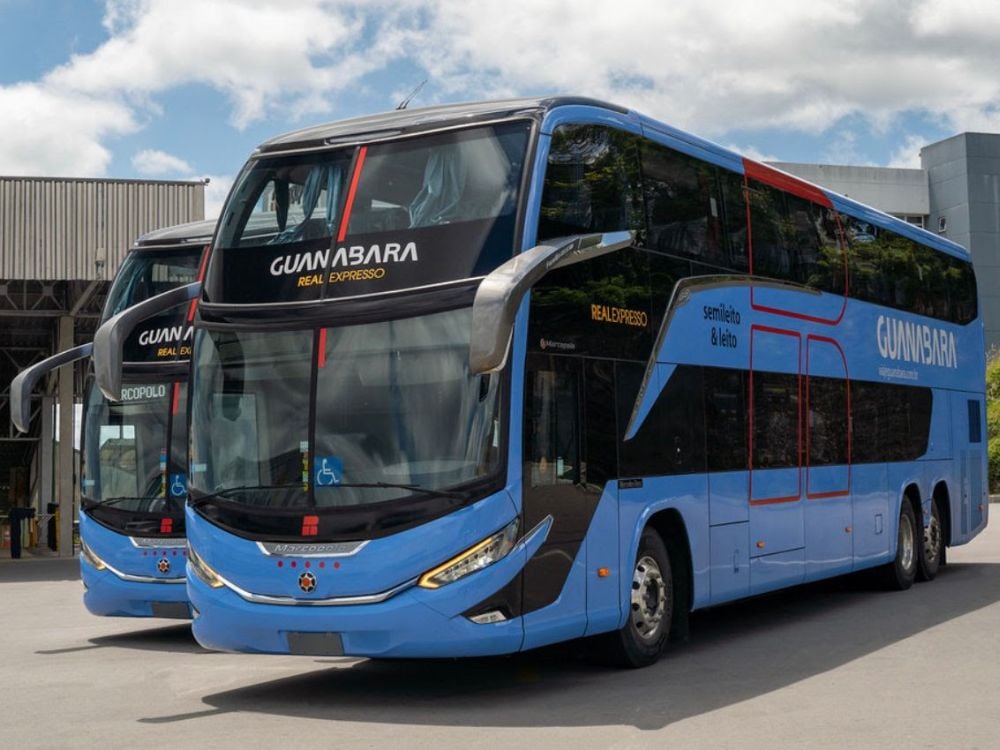 Two blue travel buses from Guanabara and Real Expresso parked. A road transport option to get to Chapada Diamantina. Two blue travel buses from Guanabara and Real Expresso parked. A road transport option to get to Chapada Diamantina.