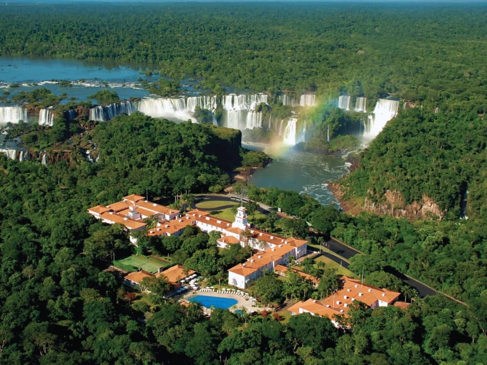 Aerial view of Belmond Hotel das Cataratas nestled in the forest near the Iguacu Falls. Aerial view of Belmond Hotel das Cataratas nestled in the forest near the Iguacu Falls.