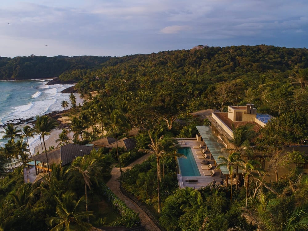 Aerial view of Barracuda Boutique hotel featuring a long pool overlooking the Atlantic ocean. Aerial view of Barracuda Boutique hotel featuring a long pool overlooking the Atlantic ocean.