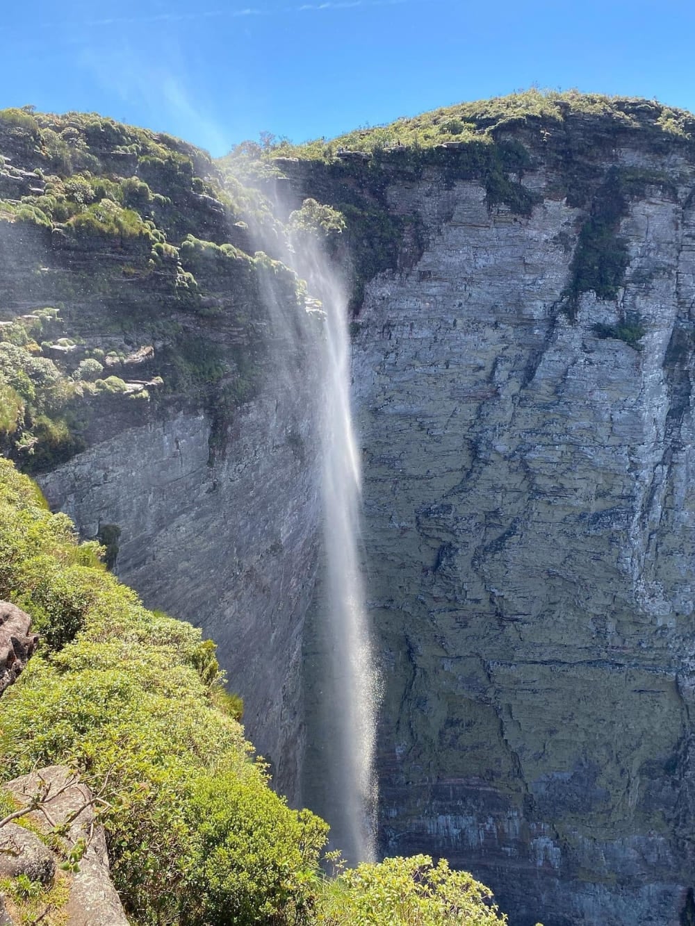 The 340-meter Fumaça Waterfall flows over a steep cliff, with its water turning into a smoke-like mist before reaching the bottom. The 340-meter Fumaça Waterfall flows over a steep cliff, with its water turning into a smoke-like mist before reaching the bottom.