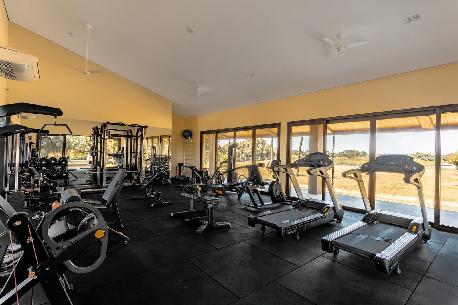 No excuses to skip leg day, not when the view from the treadmill is that good. Well-equipped fitness center with treadmills, weight machines, and floor-to-ceiling windows overlooking open savanna on this luxury Pantanal and Amazon trip